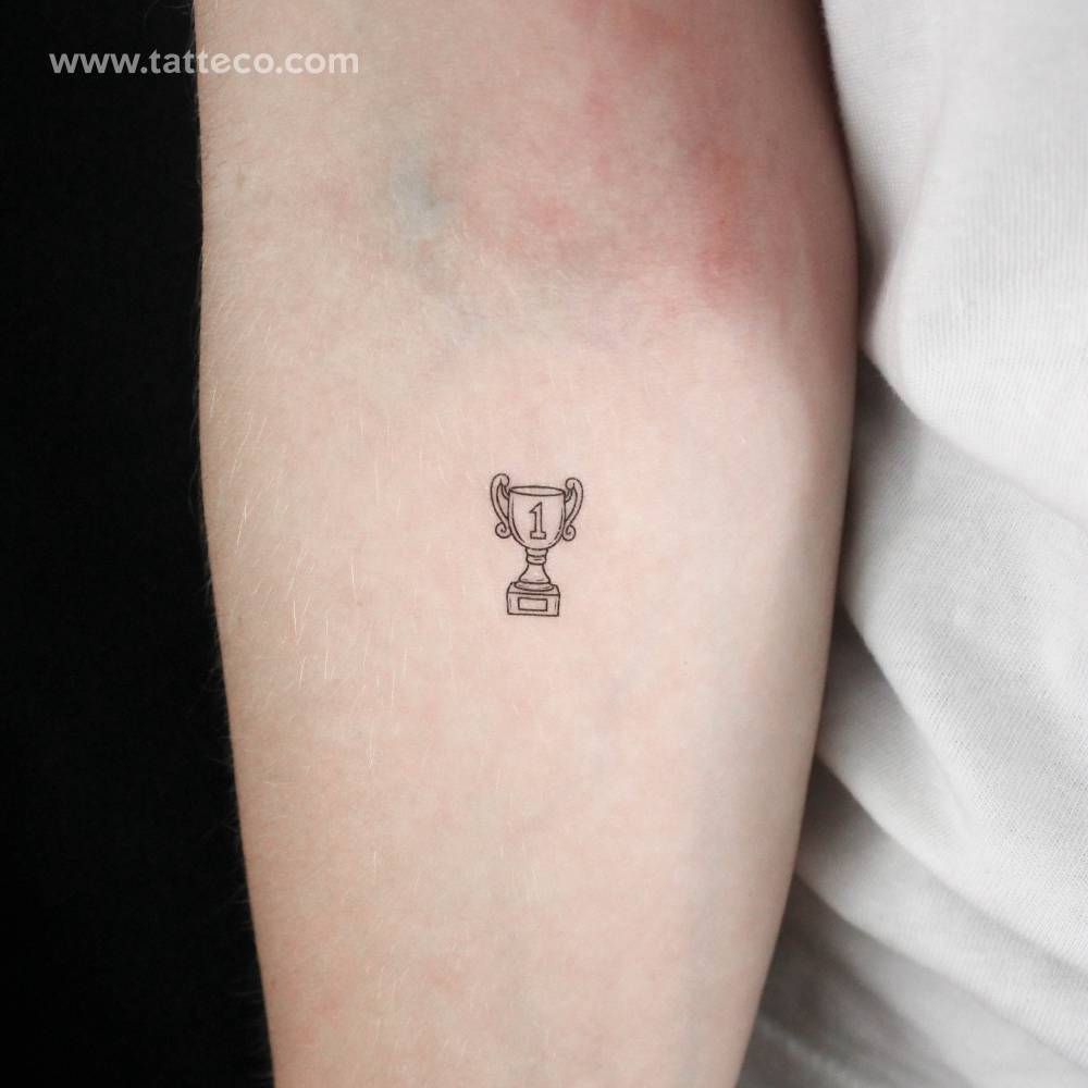 Fine line style little trophy temporary tattoo.