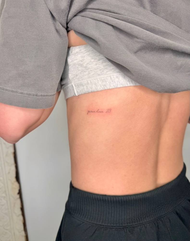 "Psalm 23" tattoo located on the rib.