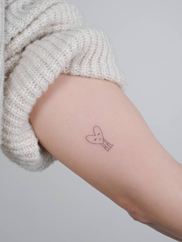Sad heart tattoo located on the inner forearm, fine line style.