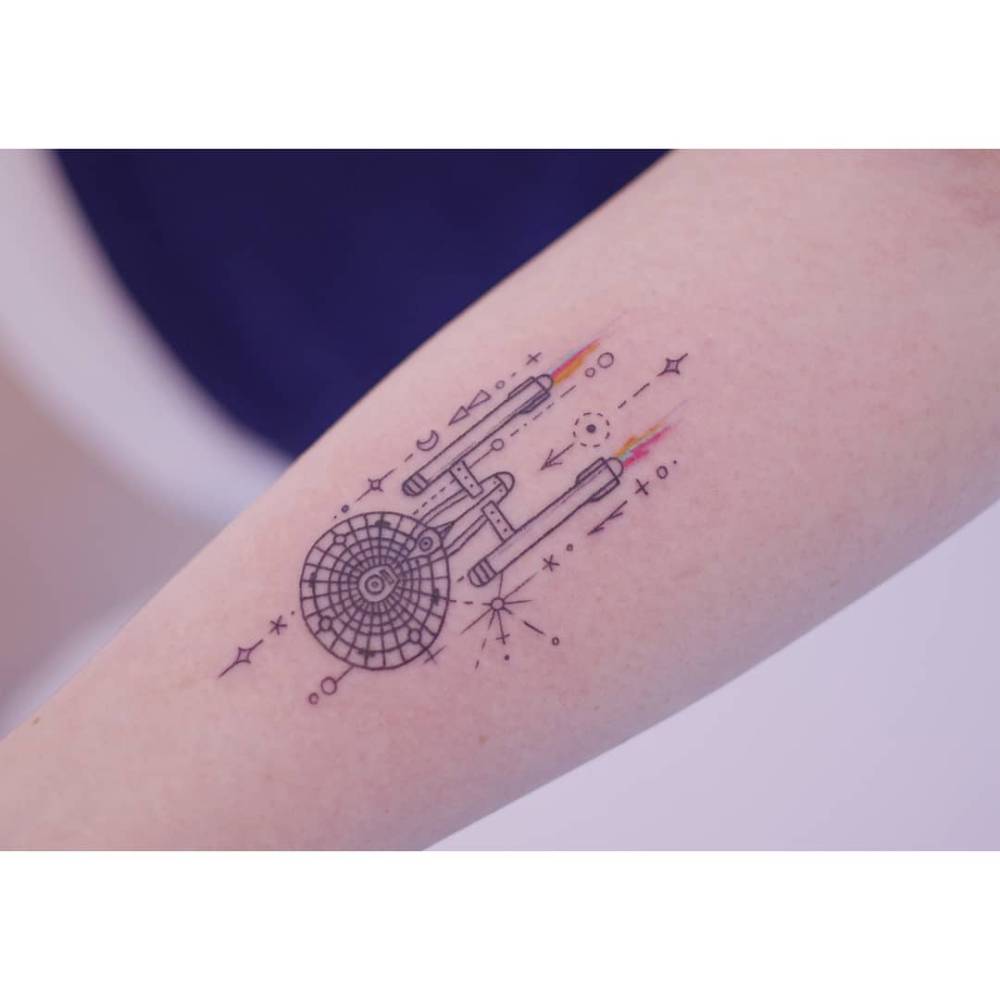 U.S.S. Enterprise tattoo located on the inner forearm.