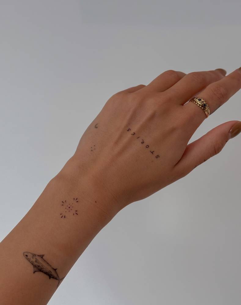 Minimalistic ornamental design tattooed on the wrist.