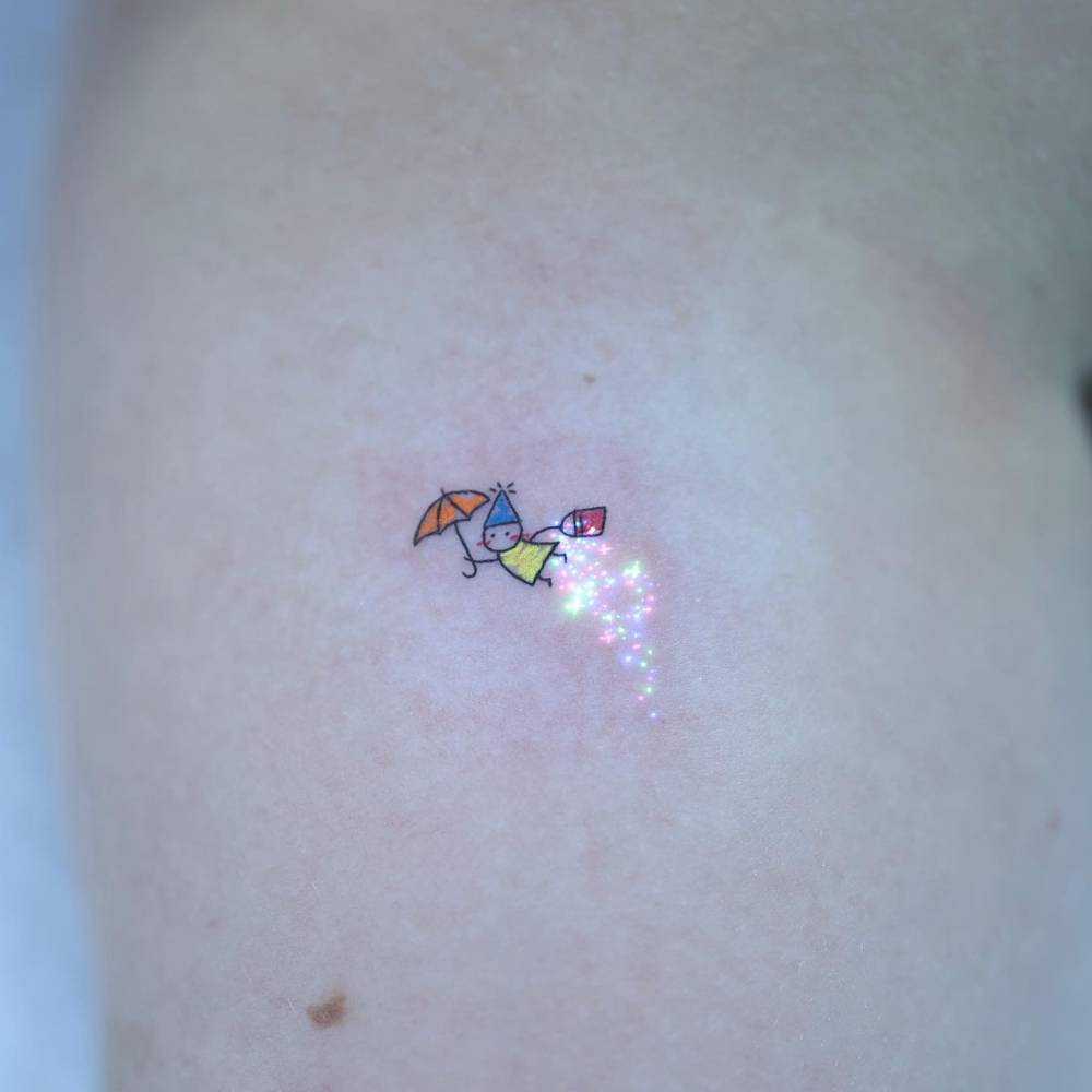 I’m a lucky fairy friend who flies around on an umbrella.