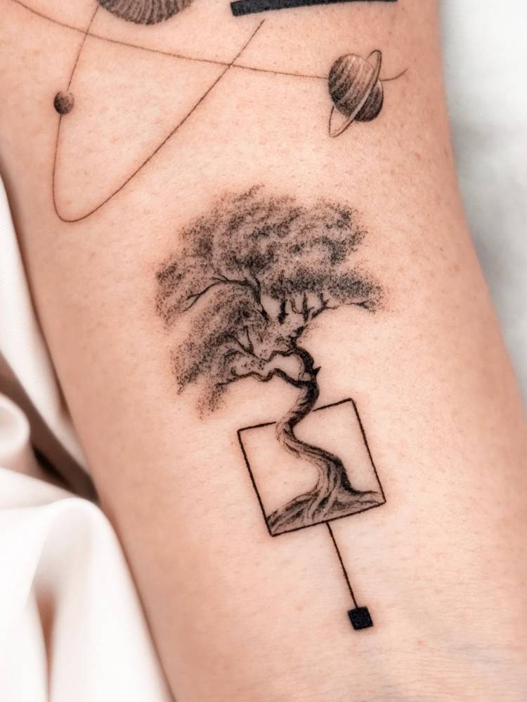 Bonsai tattoo in illustrative style located on the wrist.