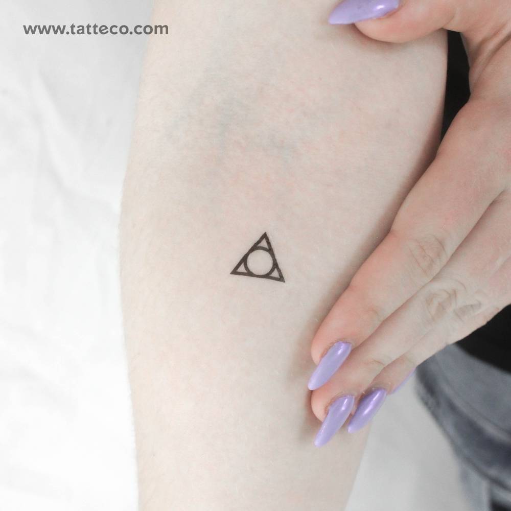 Solomonic triangle of art temporary tattoo located on the inner forearm.