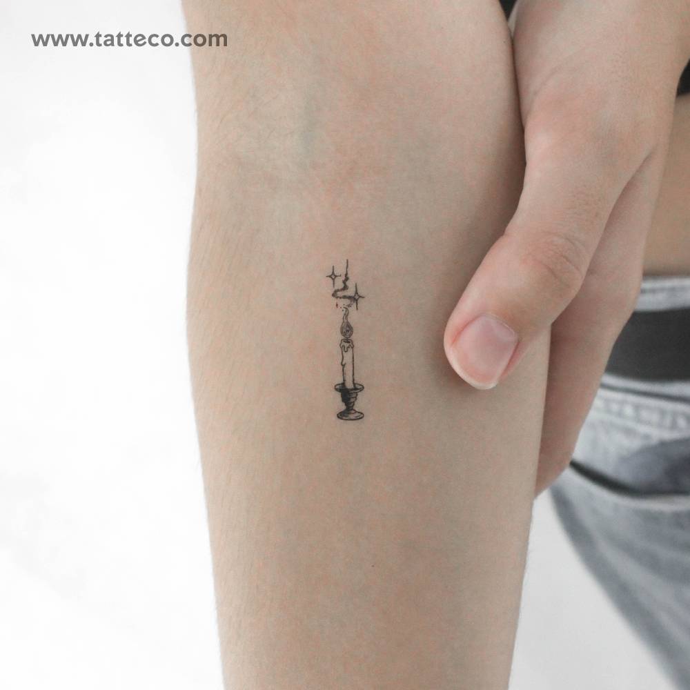 Candle temporary tattoo placed on the inner forearm.
