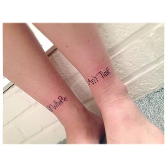 Words "anywhere" and "anytime" tattooed on the ankles.