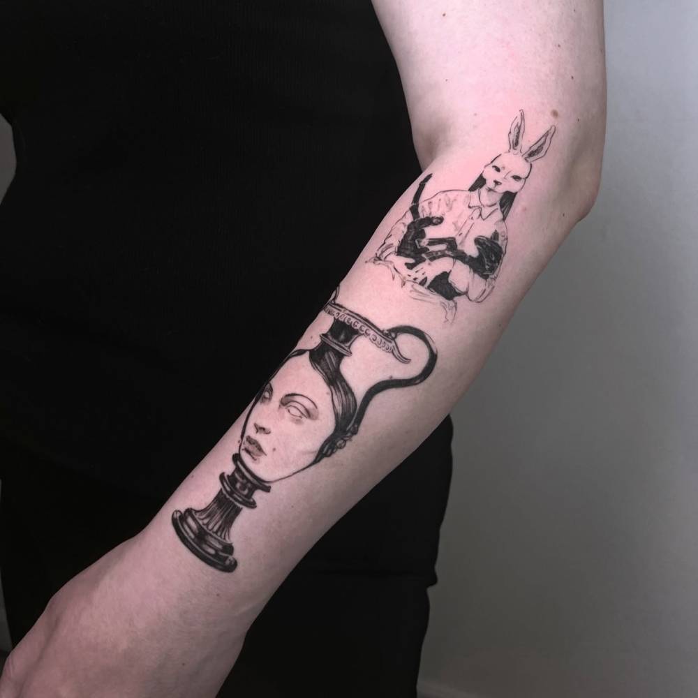 Vase and face tattoo located on the forearm, surrealistic style.