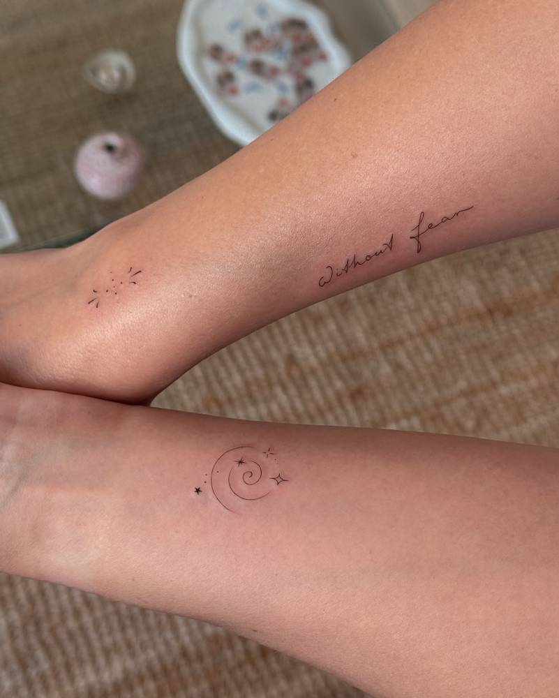 Ornament, universe spiral and "without fear" tattoos.