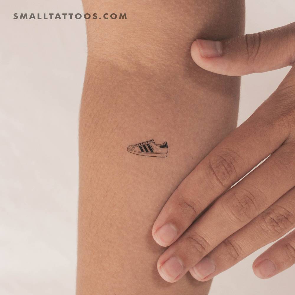 Adidas Superstar temporary tattoo located on the inner forearm.