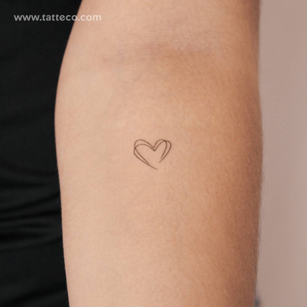 Small double heart semi-permanent tattoo.