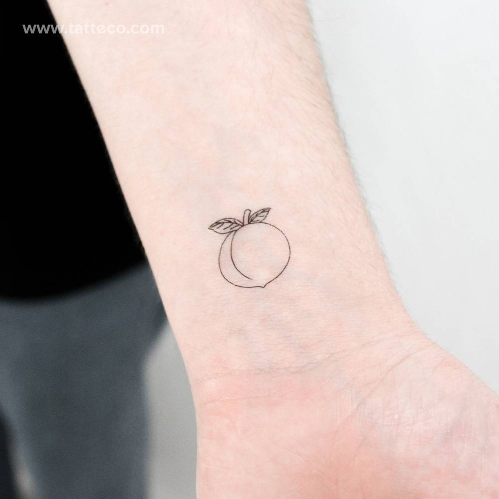 Fine line style peach temporary tattoo located on the wrist.