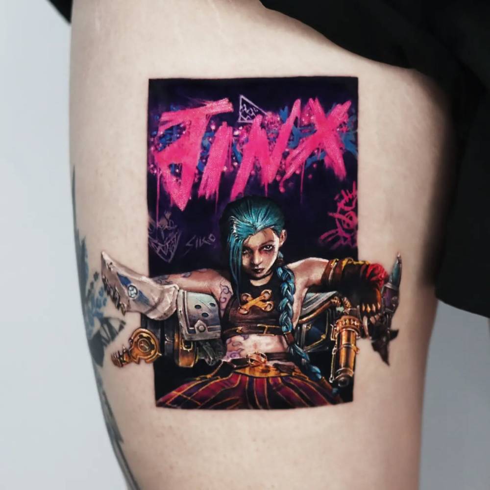 League of Legend's Jinx tattoo located on the thigh, cartoon style.