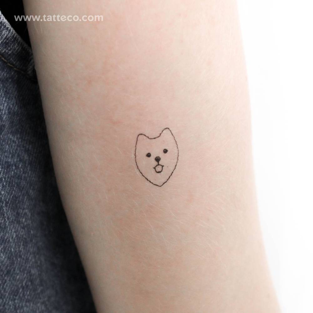 Pomeranian face temporary tattoo located on the inner forearm.