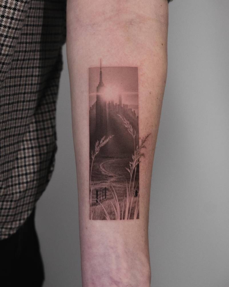 Micro-realistic style landscape tattoo located on the inner forearm.