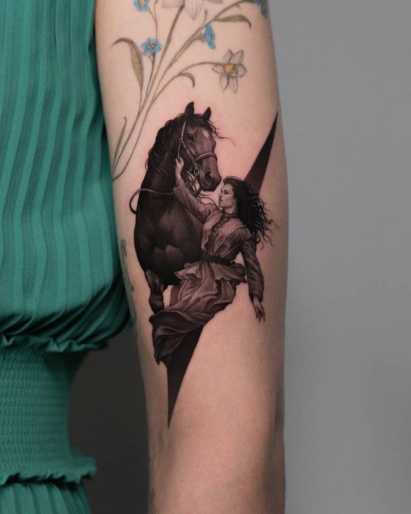 Woman and horse tattoo located on the upper arm, micro-realistic style.