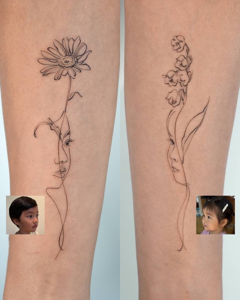 Her children's portrait and flowers tattooed on the inner forearm.