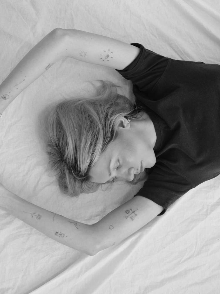 FIne line style arm composition tattoos.