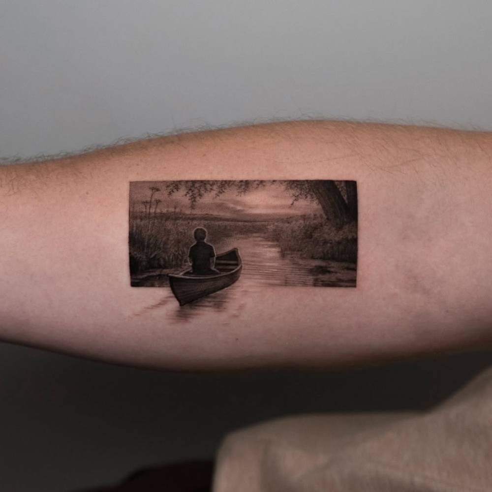 Micro-realistic style landscape tattoo located on the inner forearm.