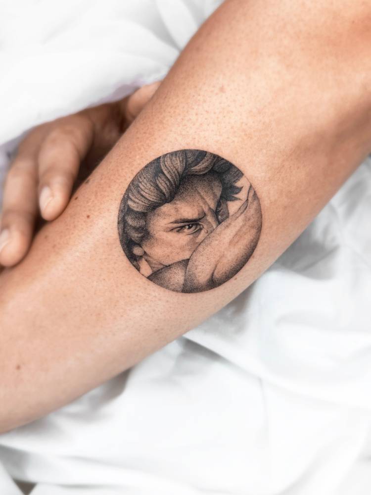 'Fallen Angel' tattoo located on the forearm.