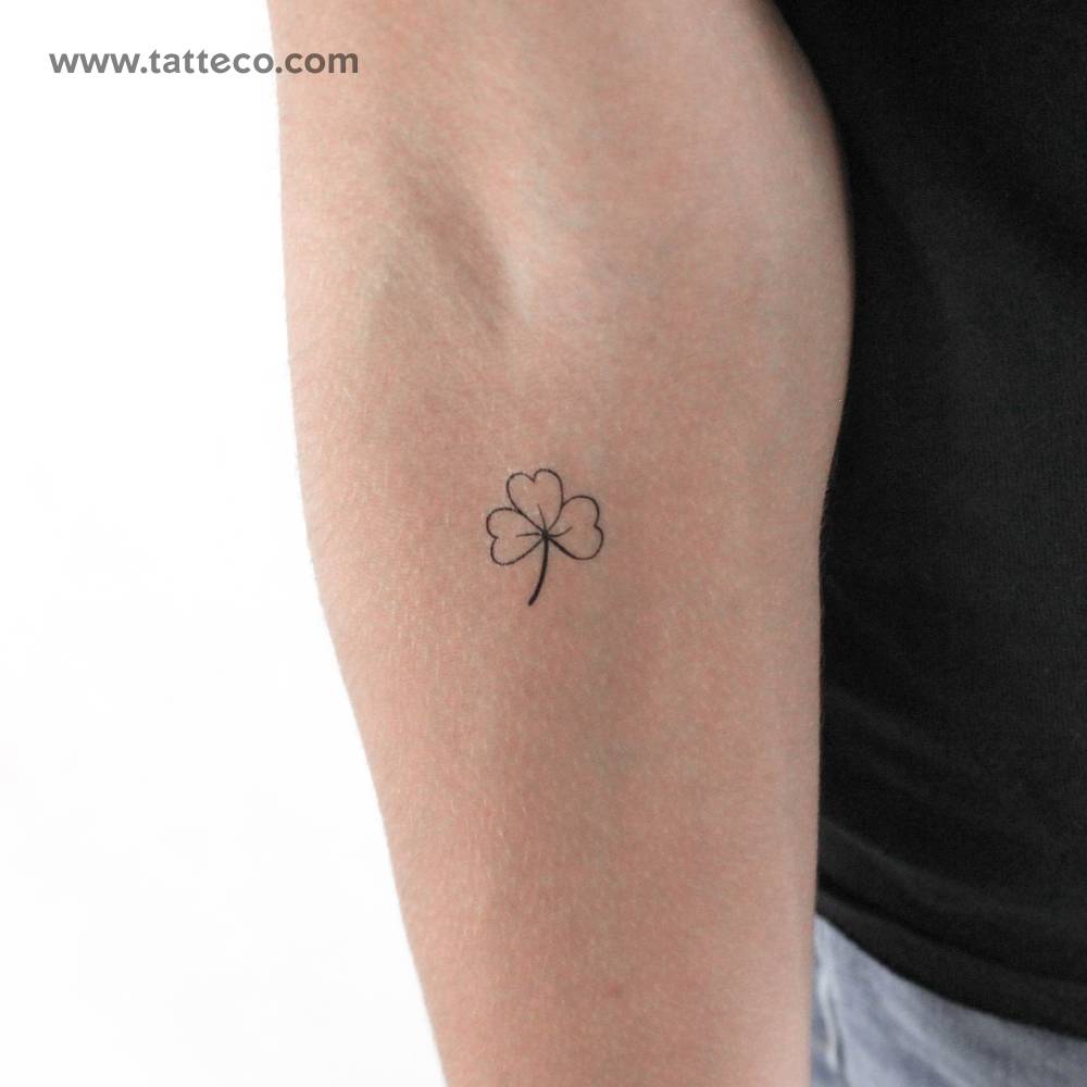 Hand-drawn three-leaf clover temporary tattoo.