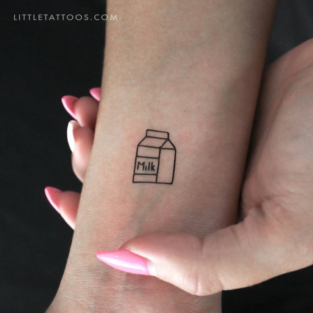 Minimalist style milk temporary tattoo located on the wrist.