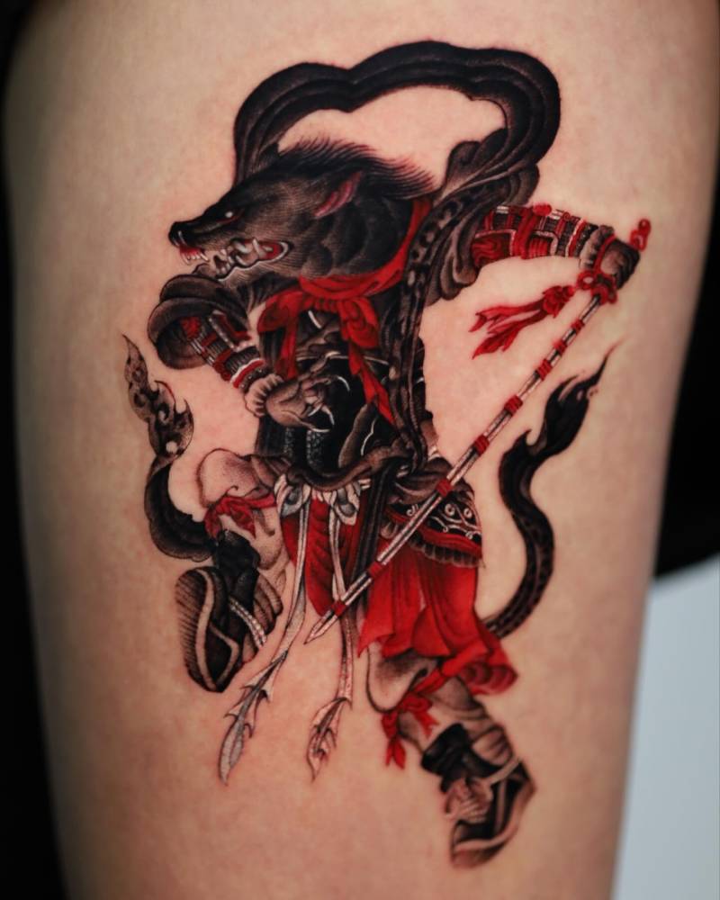 Samurai wolf tattoo in oriental style located on the thigh.
