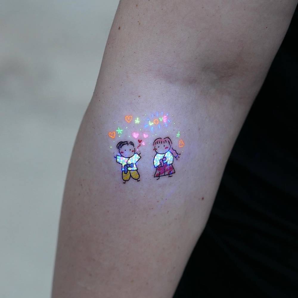Korean wedding tattoo in cartoon style located on the forearm.