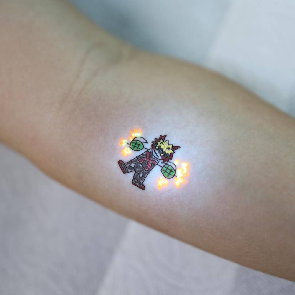 Katsuki Bakugo tattoo in cartoon style located on the inner forearm.