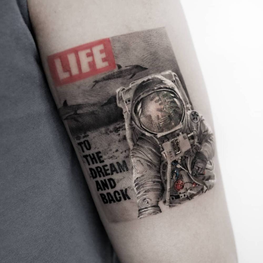 LIFE Magazine tattoo in micro-realistic style located on theupper arm.