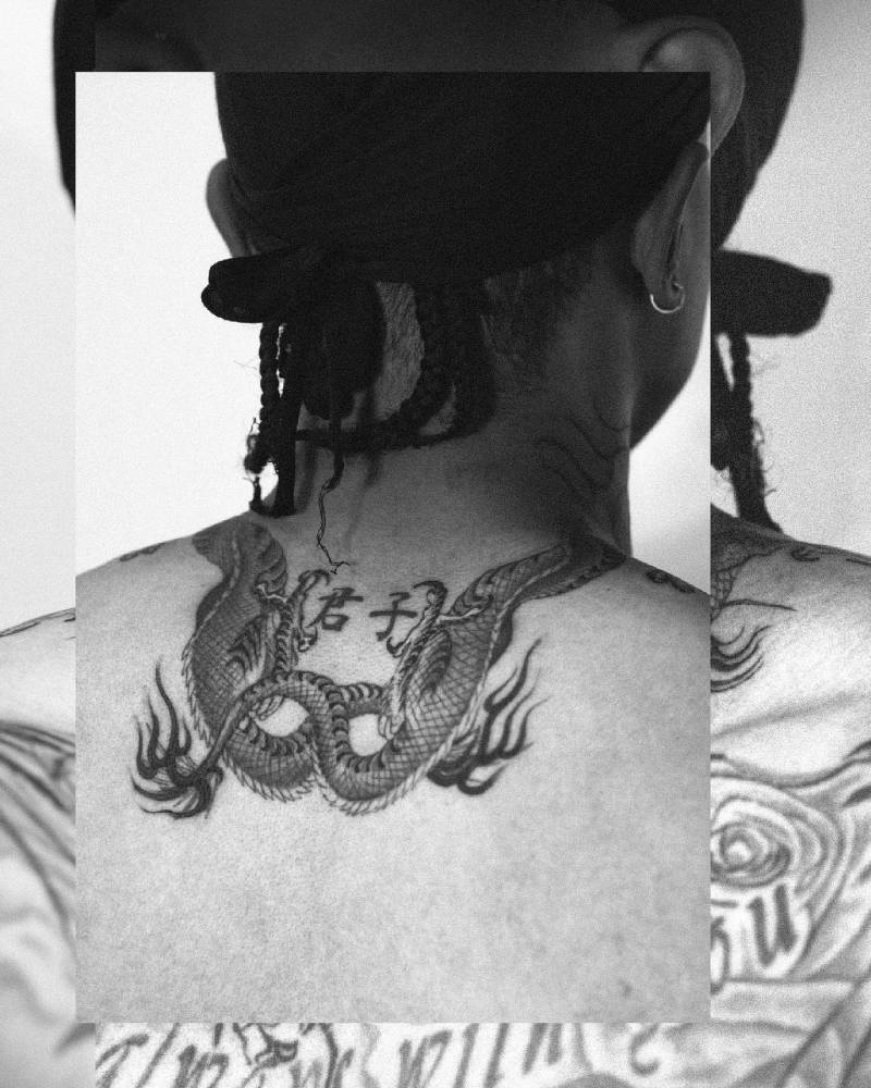Oriental style dragon tattoo located on the upper back.
