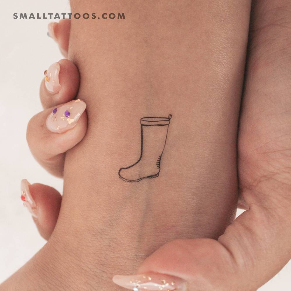 Rain boot temporary tattoo located on the wrist.