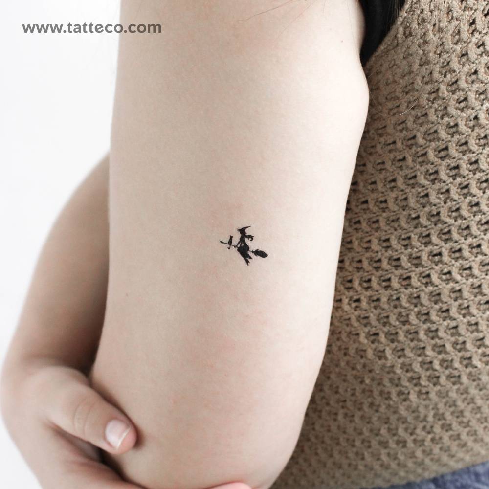 Flying witch temporary tattoo located on the tricep.