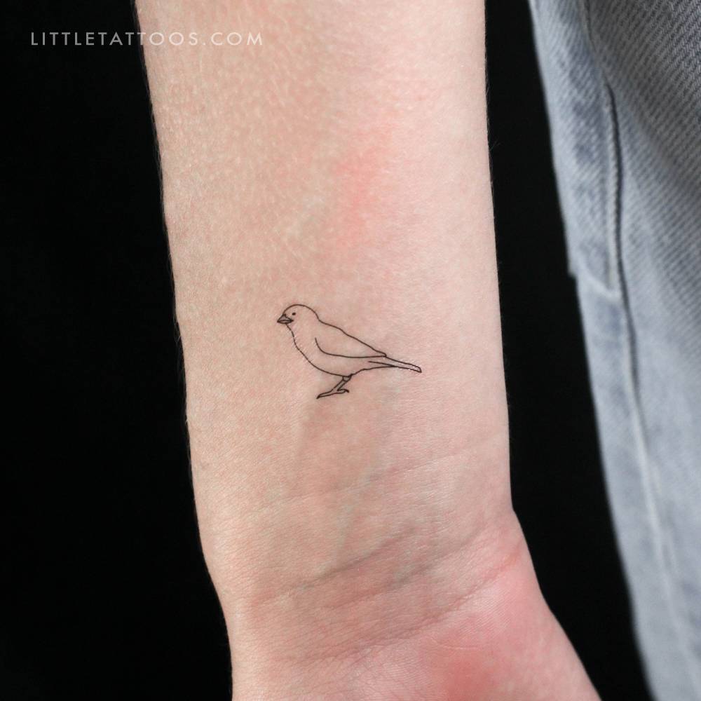 Tiny fine line sparrow temporary tattoo located on the wrist.