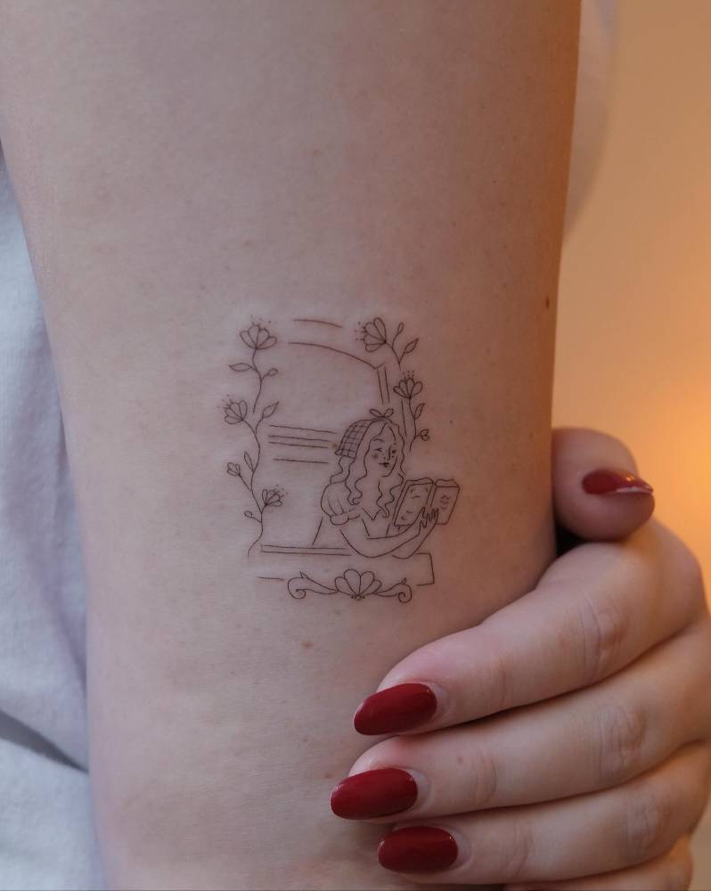 Woman on a window tattooed on the upper arm, fine line style.