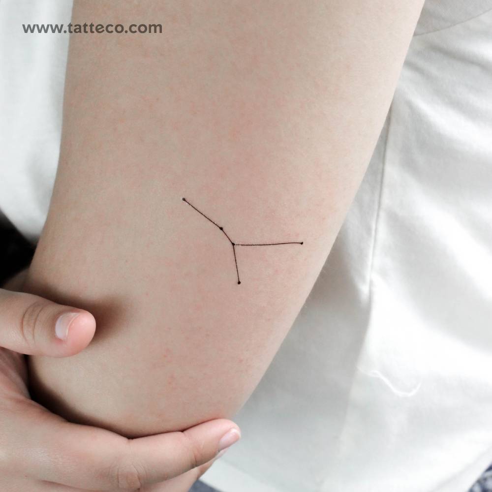 Cancer constellation temporary tattoo located on the tricep.