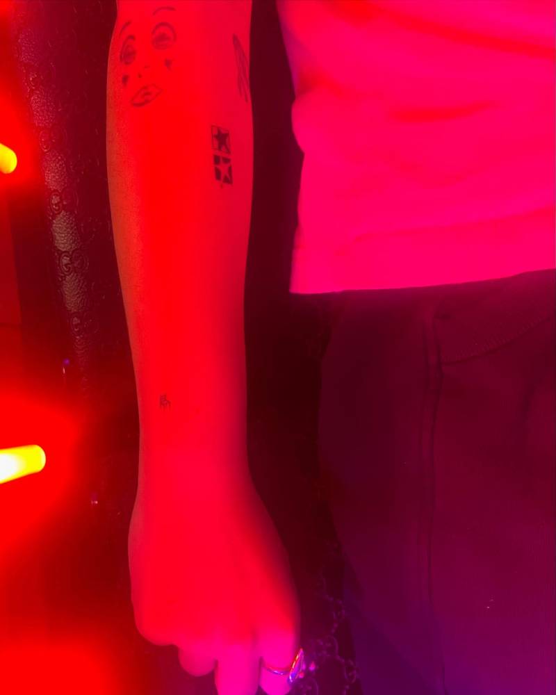Star couple tattoo located on the forearm, minimalistic style.