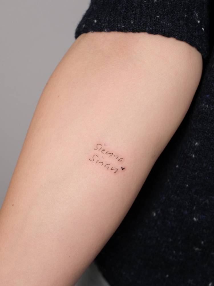 Names "Sienna" and "Sinan" tattooed on the inner forearm.