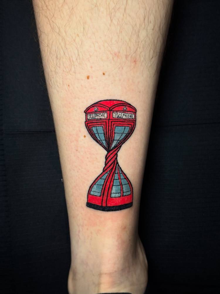Twisted phone booth tattoo, original sculpture by Alex Chinneck.