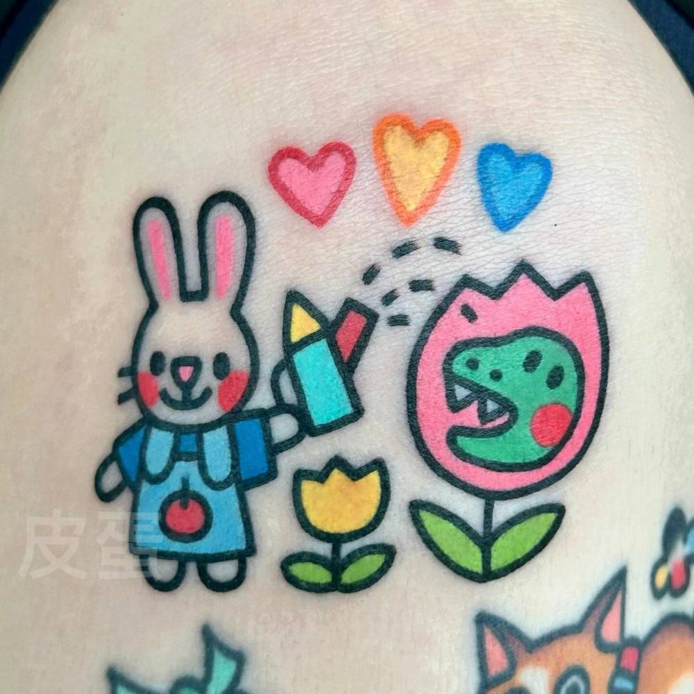 Bunny watering a dinosaur tulip tattooed on the shoulder.