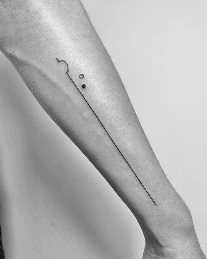 Minimalist geometric tattoo located on the forearm.