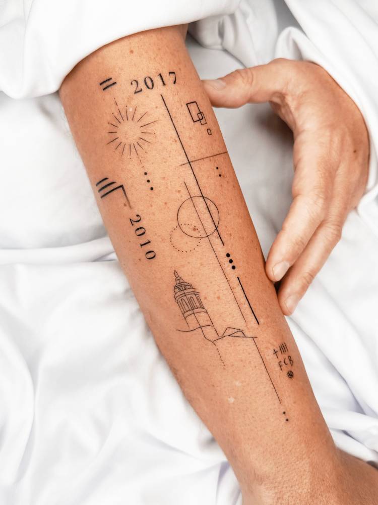 Graphic style forearm composition tattoos.