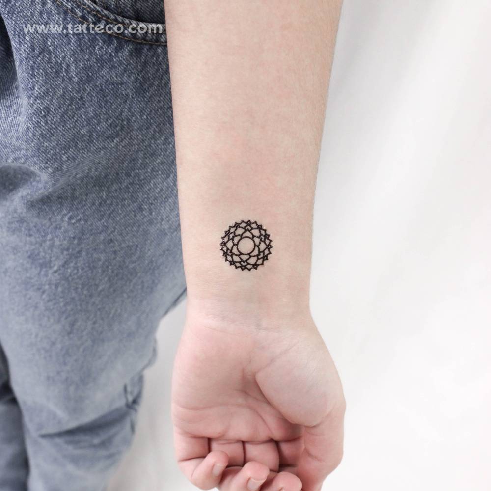 Sahasrara chakra temporary tattoo located on the wrist.