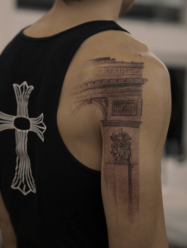 Arc de Triomphe tattoo in black and grey style .