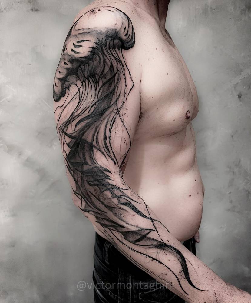 Jellyfish tattoo in sketch work style placed on the arm.