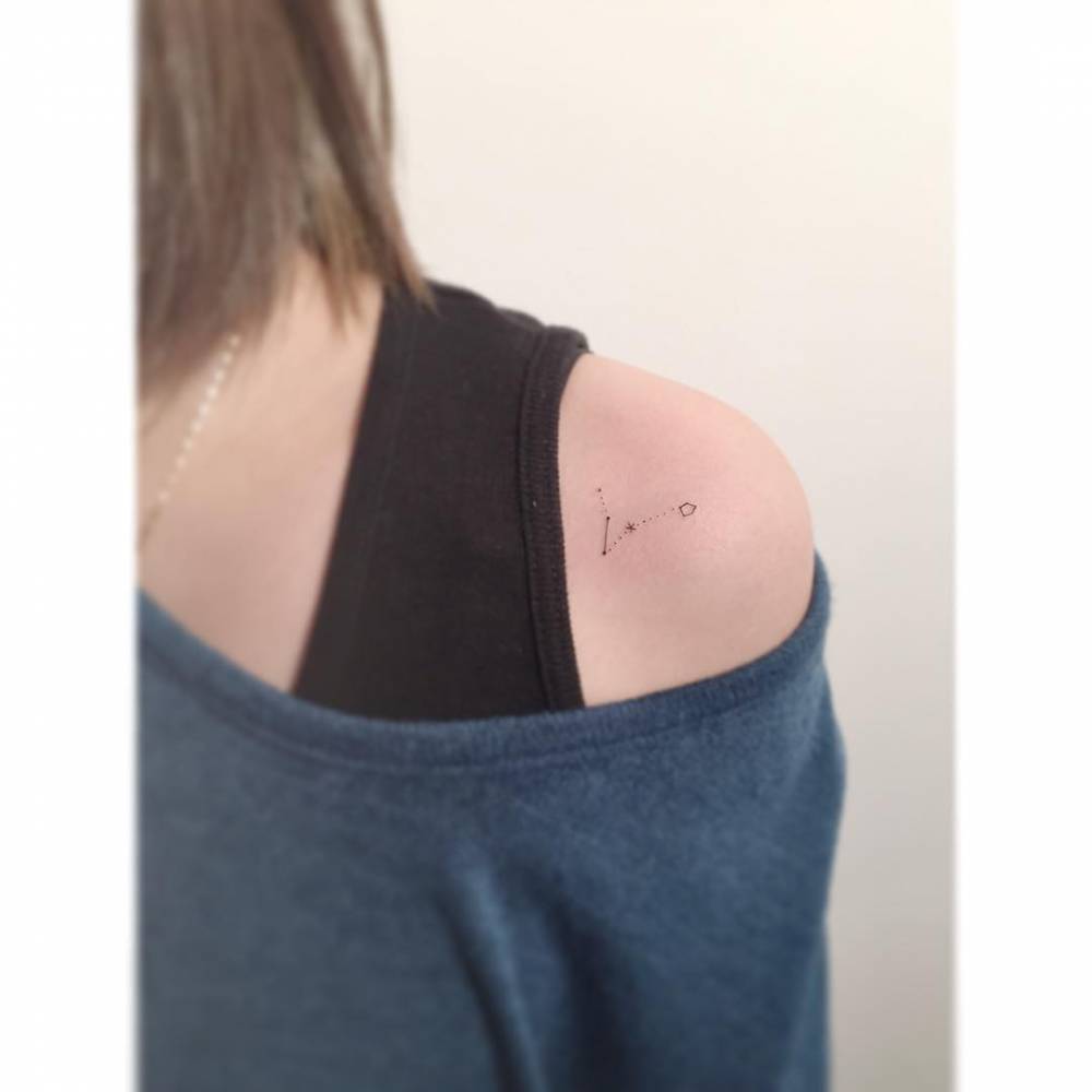 Pisces constellation tattoo in minimalistic style.