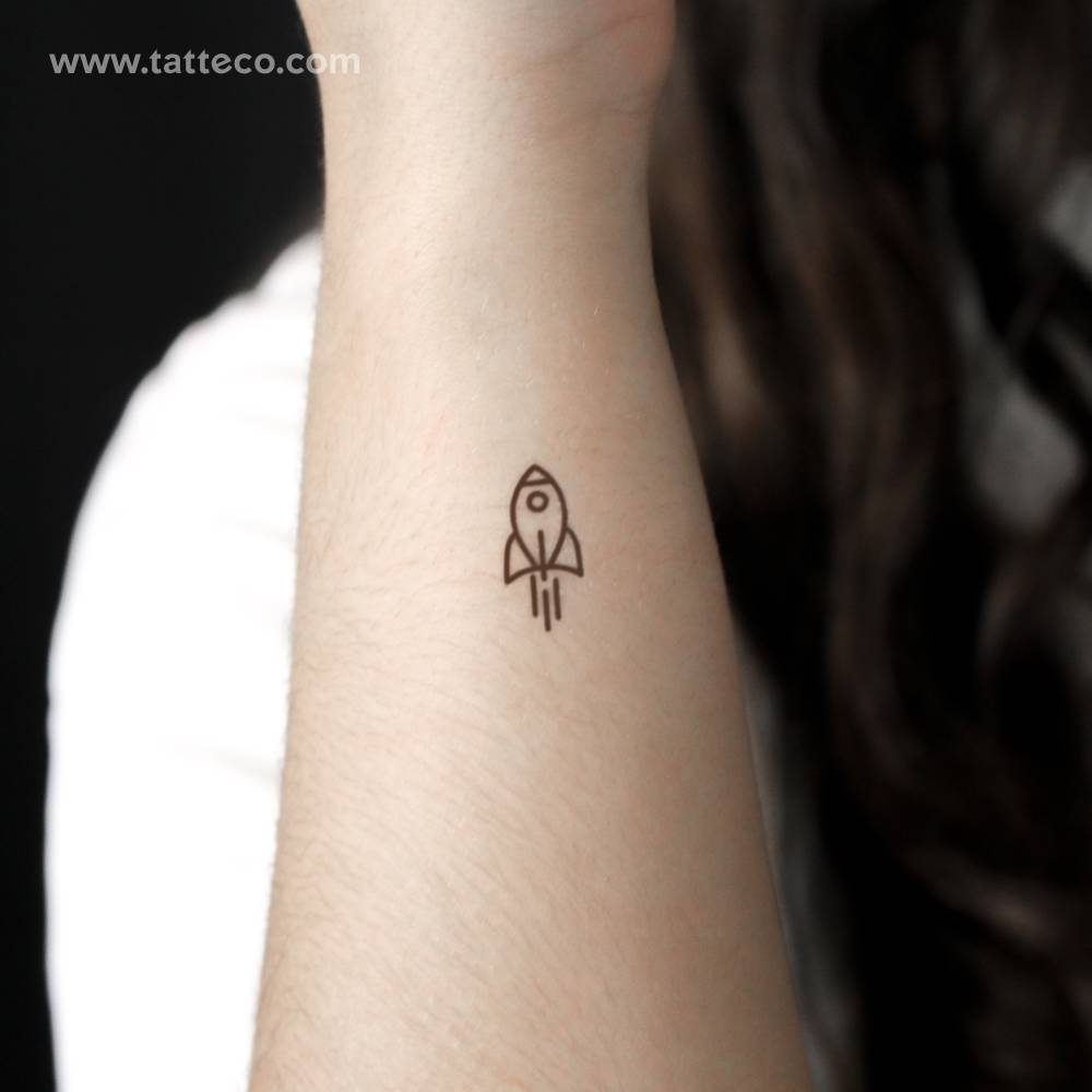 Minimalist rocket semi-permanent tattoo located on the wrist.