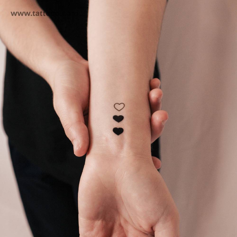 Matching 3 hearts semi-permanent tattoo.