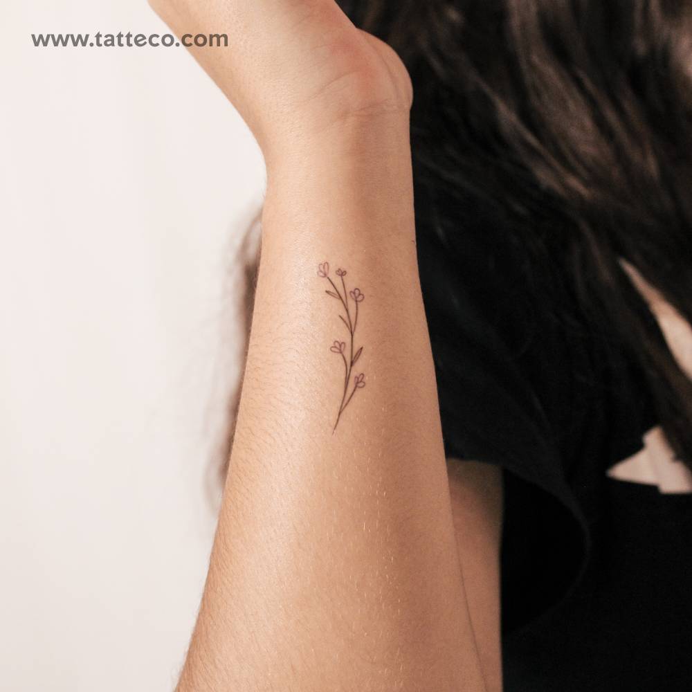 Fine line style baby's breath temporary tattoo.