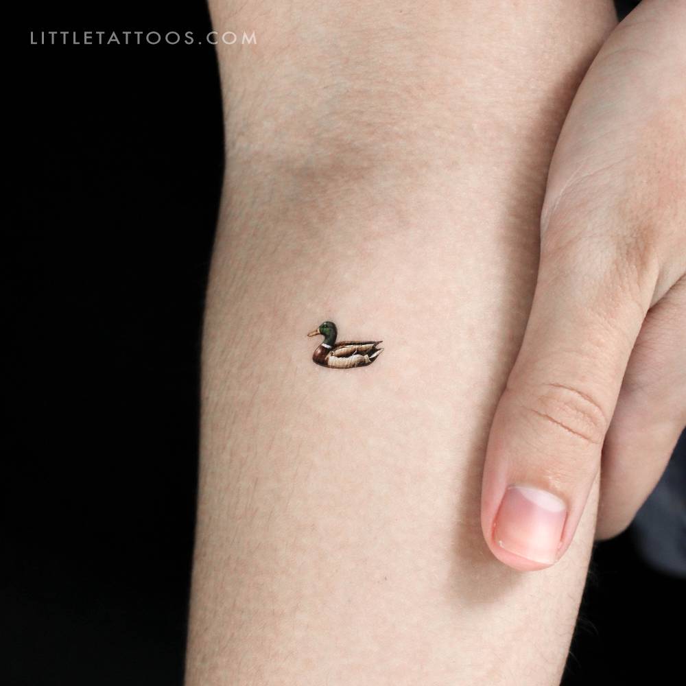 Micro-realistic style tiny duck temporary tattoo.
