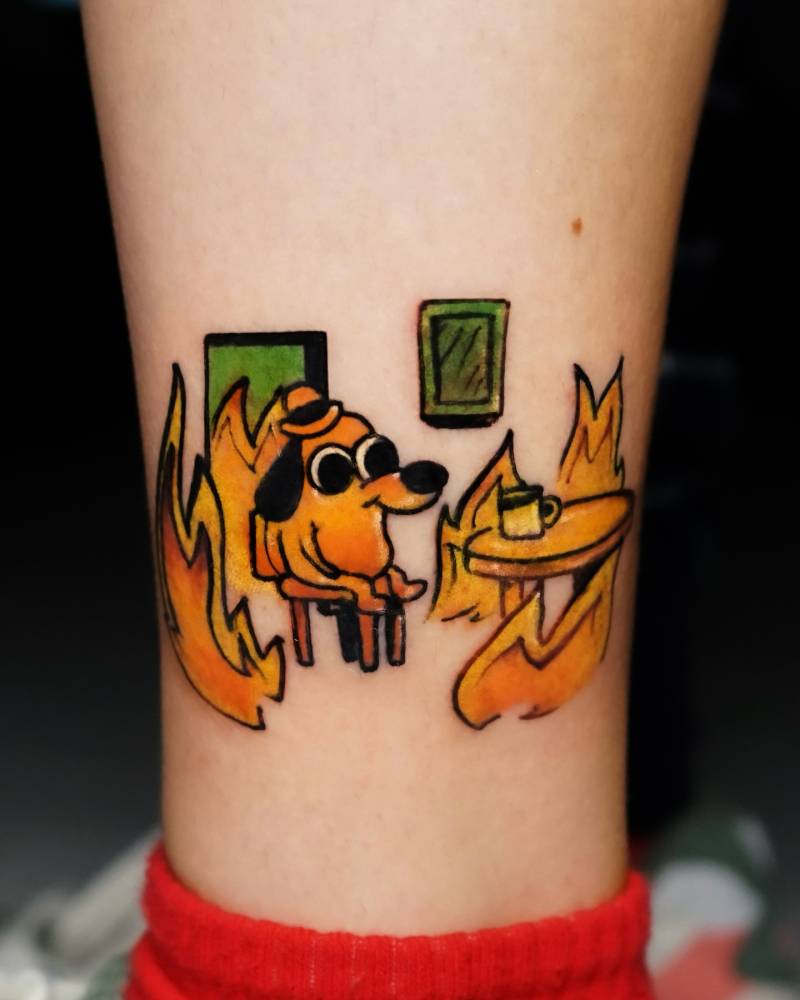 "This is fine" meme tattooed on the ankle.